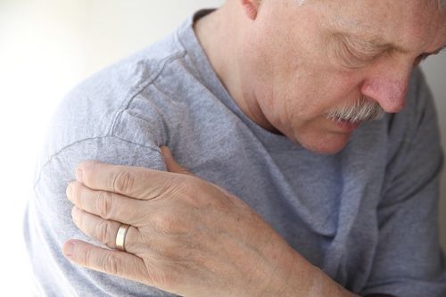 Man experiencing shoulder pain in need of pain relief.